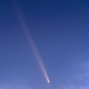 Photograph of Comet Tsuchinshan-ATLAS with its tail over Capitol Reef National Park in Utah.
