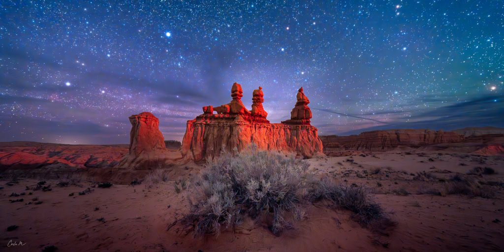 Night Queens A panoramic night photograph of a rock formation under a starry sky at Goblin Valley State Park, Utah.