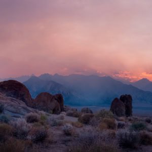 Smokey sunset over the Eastern Sierra mountains and Alabama Hills in California.