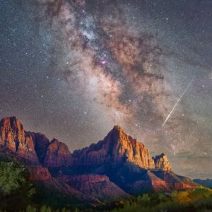 Milky Way photograph with a meteor streak over Watchman peak in Zion National Park, Utah.